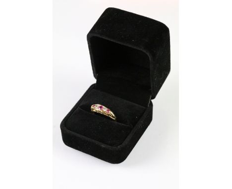 Antique 18ct gold ruby and diamond boat head ring. The ring having a navette shaped head set with three round brilliant cut d