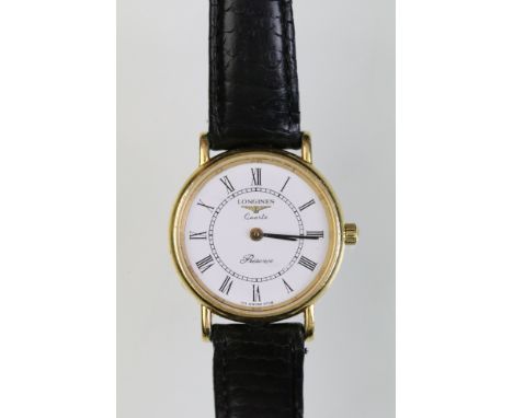 Longines Presence ladies wrist watch having a round face with a white dial and roman numerals to the chapter ring within a ye