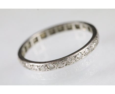 Diamond set full eternity ring set with round cut diamonds throughout the band. Unmarked. Size R. 