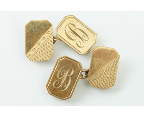 Pair of 9ct gold hallmarked cufflinks. Having rectangular heads with engine turned details, united by chains. Hallmarked Birm