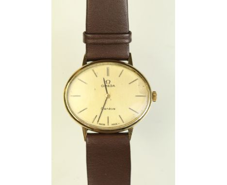 Omega Geneve ladies wrist watch having an oval face with gilt dial and baton markers to the chapter ring. Measures 32mm wide.