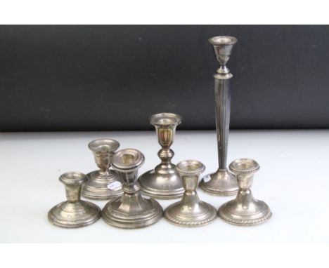 Six American weighted silver candlesticks to include a pair by Gorham with reeded rims and assorted other makers, as well as 