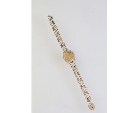 9ct gold gate link bracelet set with a 1/10 oz fine gold coin with heart padlock clasp. Hallmarked London 1987. Measures 7 in