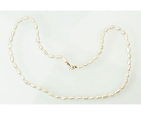 Cultured pearl necklace with a 9ct gold spring ring clasp. Measures 16 inches. Marked 9ct to clasp. 