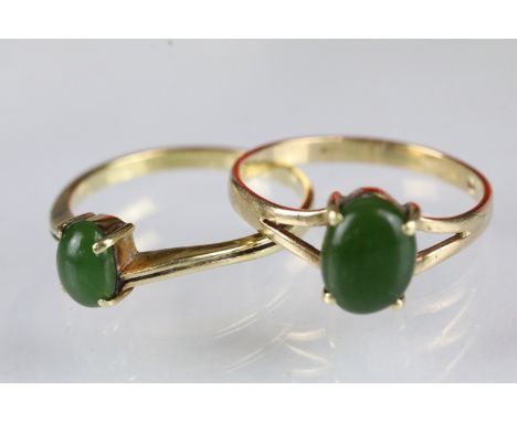 Two Nephrite set rings both set with oval green cabochons. Crossover ring marked 14ct, other marked 9ct op, 925. Sizes P.5 an