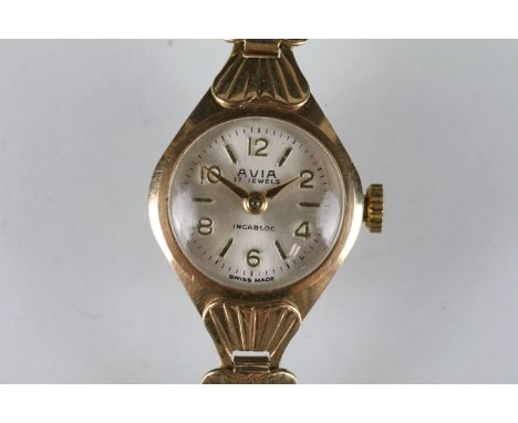 9ct gold Avia cocktail watch having a round face with Arabic numerals to the chapter ring and mounted to a scallop shell desi