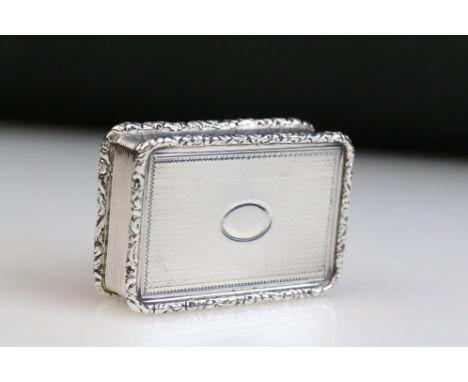 Early 19th Century George IV silver snuff box having an engine turned exterior with oval initial panel to lid and moulded flo