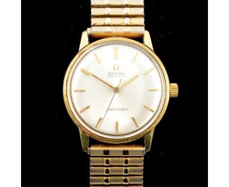 Omega - a gentleman's Seamaster gold-plated automatic wristwatch, the 29mm circular champagne dial with baton markers in a 34