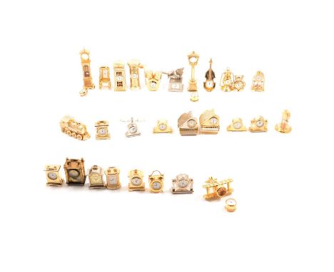 Thirty miniature novelty carriage clocks, gilt coloured in the form of grand pianos, rocking chair, tilley lamp; footballer; 