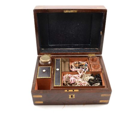 A mahogany travelling case with original key and lock; costume jewellery bead necklaces, linen,crotchet and tatting work, hip