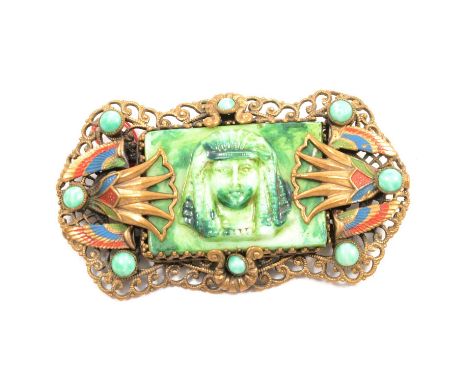 Brooch influenced by Egyptian Revival, probably Max Neiger of Gablonz, pseudo Egyptian pressed opaque glass panel to centre, 