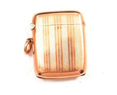 A 9 carat yellow gold vesta match case, engine turned design, Birmingham 1911, A&amp;Co Ltd. 37x27mm, no engraved monograms o