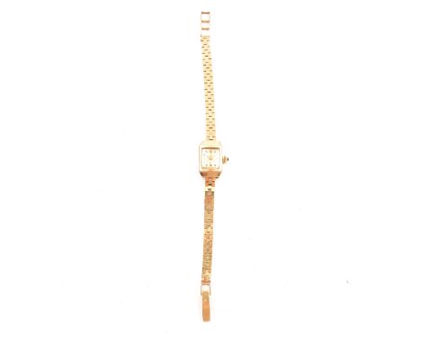 Smiths Imperial- a lady's 9 carat yellow gold bracelet watch, rectangular white baton dial with quarter arabics in a 9 carat 