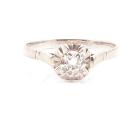 A diamond solitaire ring, the 5.2mm old cut stone set with four raised claws in an all white metal mount ring size T, gross w