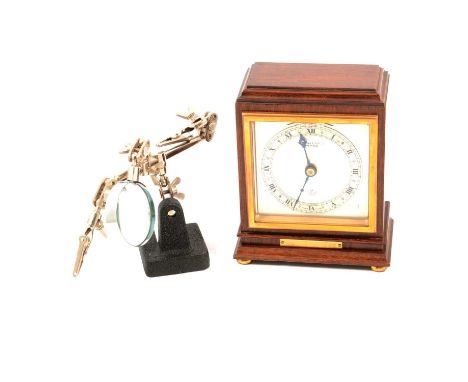 A collection of pocket watch parts and an Elliott mantel clock, to include white enamel dials; balance wheels; movements; dus