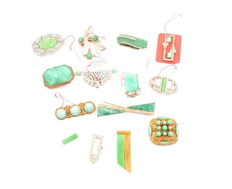 Thirteen Peking glass and similar Art Deco dress clips and broaches, a 50mm paste set brooch with moulded green glass panel t