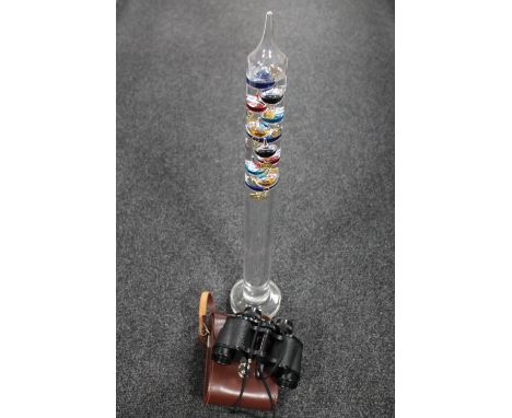 A set of leather cased Carl Zeiss binoculars and a Galileo thermometer 