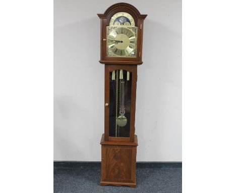 A reproduction mahogany longcase clock with brass moonphase dial 