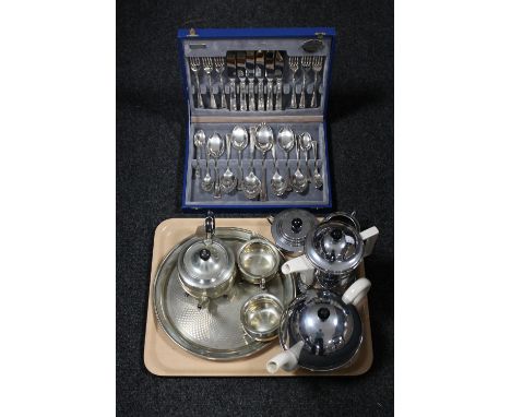 A tray of canteen of plated cutlery, three piece plated Yeoman Plate tea service on tray, four piece chrome tea service 