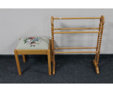 An oak tapestry upholstered dressing table stool together with a barley twist towel rail