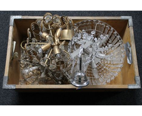 A crate containing three assorted light fittings with glass drops 
