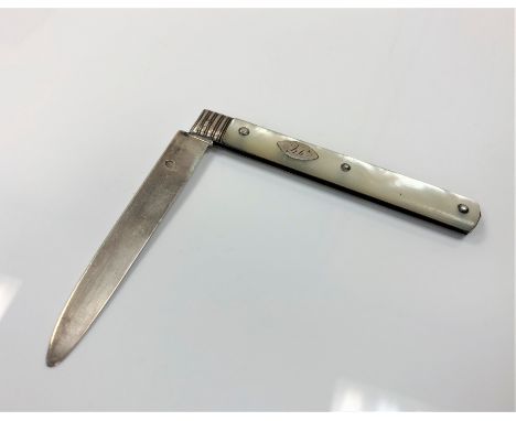 A large Georgian silver and mother of pearl fruit knife CONDITION REPORT: 6.5" total length. 