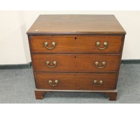 A George III mahogany three drawer chest on bracket feet, width 95 cm 