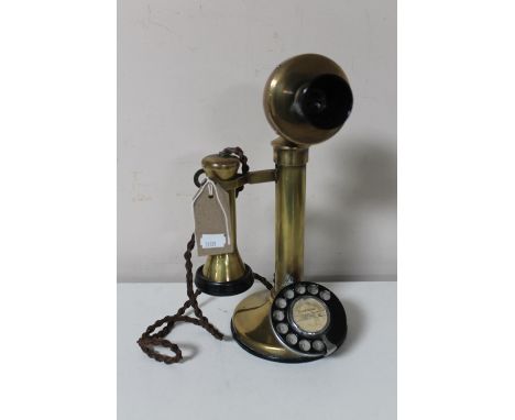 An early 20th century brass candlestick telephone 