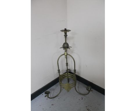 A decorative brass gas three way light fitting 