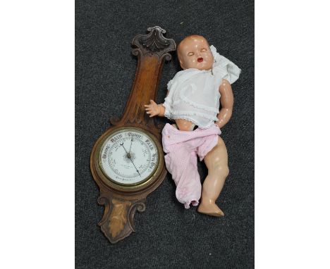 A Victorian oak aneroid barometer by W. J. Hassard &amp; Company of Glasgow and a 20th century plastic doll 