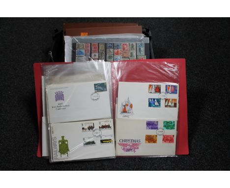 A basket of stamp albums, first day covers