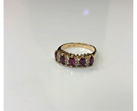 A 14ct gold five stone diamond and ruby ring, 2.9g, size K.