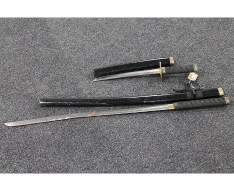 A Japanese samurai style sword and similar dagger 