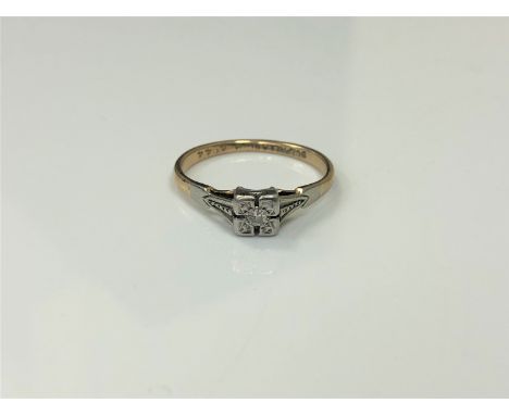 An early twentieth century diamond set 9ct and palladium mounted ring, 1.6g, size K.