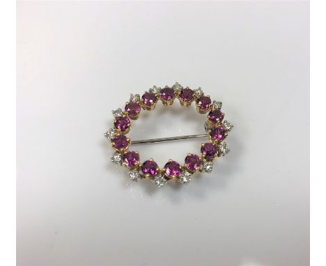 An 18ct gold ruby and diamond brooch, approximately 1.5ct, 7.2g.