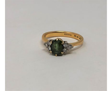 A demantoid garnet and diamond ring, size R CONDITION REPORT: 5.6g