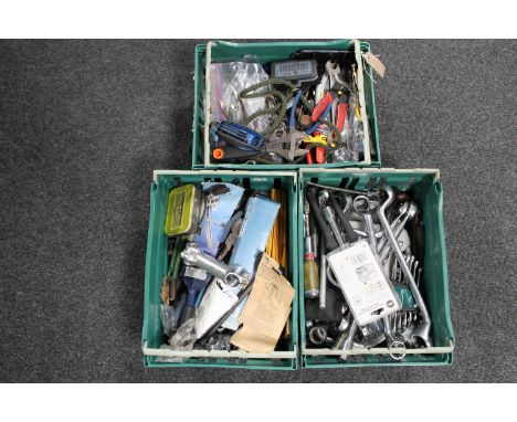 Three plastic crates containing assorted hand tools 