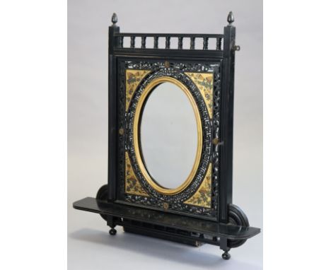 A Victorian aesthetic movement ebonised &amp; parcel-gilt over mantle mirror, the removable insert with pierced &amp; painted
