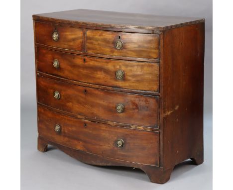 A 19th century mahogany bow-front chest fitted two short &amp; three long graduated drawers with brass ring handles, on brack