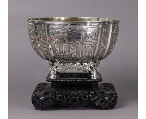 An early 20th century Chinese export silver round deep bowl decorated with panels of finely chased figure scenes, chrysanthem