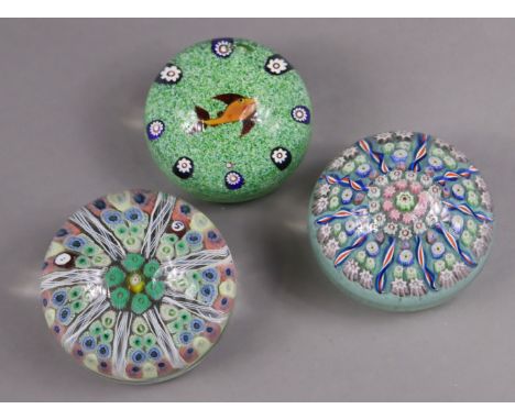 A Paul Ysart Harland glass “fish” paperweight, 7cm. diam.; a Strathearn radial millefiori glass paperweight dated ’72, 8cm.; 
