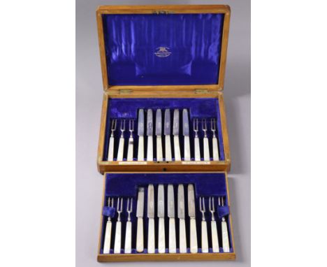 Twelve pairs of Edwardian silver dessert knives &amp; forks with mother-of-pearl handles; London 19805, by Goldsmiths &amp; S
