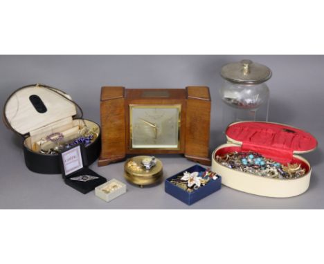 A cut glass powder jar with silver cover; a quantity of costume jewellery; &amp; a Garrard &amp; Co. mantel clock in walnut c