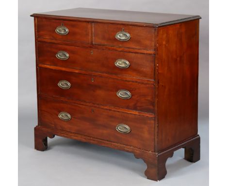 A George III mahogany chest fitted two short &amp; three long graduated drawers with later oval brass handles, on bracket oge