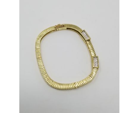 18K Gold & Diamonds Hinged Bangle. Stamped 18K inside band. Beautifully designed ribbed hinged bangle with two 3-sided diamon