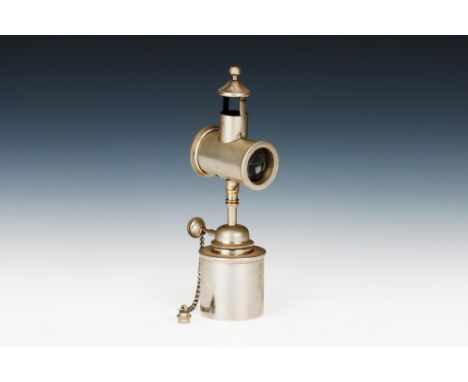 A Doctors Examination Oil Lamp, English, c.1890, unsigned finished in nickle with oil bottle wick and bulls-eye lens