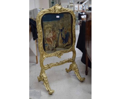 Louis XV style giltwood and gesso fire screen, with embroidered panel behind glass, 41" high