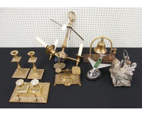 Mixed metal ware including a decorative brass desk stand with glass ink wells, set of postal rates scales, pair of candlestic