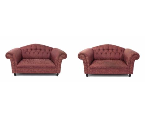 Pair of purple upholstered two-seater Chesterfield settees, with button backs upon short ebonised turned feet, 64" wide, 36" 