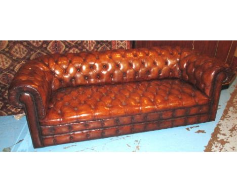 CHESTERFIELD SOFA, early 20th century faded tan hide leather with deep button upholstered back arms and seat, 218cm W.